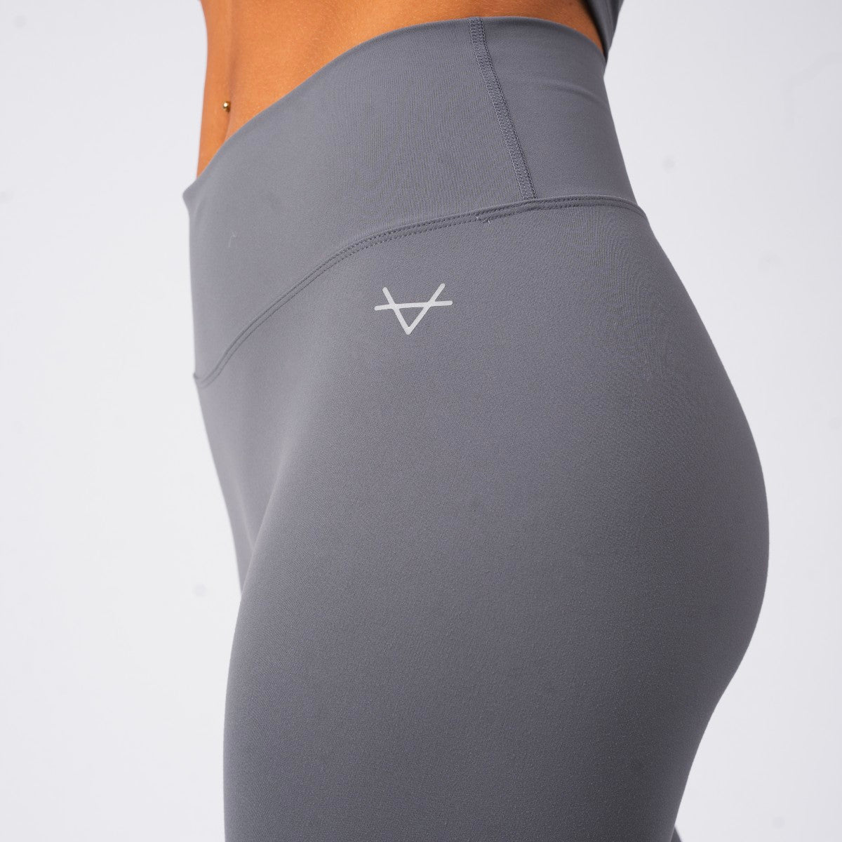 Gray leggings with a logo on a white background