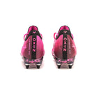 Pink and black Oxen Metasock AG artificial grass football boot, back side of shoes. Oxen writing featured on heel.